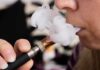 Urgent Warning For Anyone Vaping While on GLP1’s Close-up of a person vaping, exhaling smoke clouds
