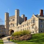 Gothic-style college building with archway and towers