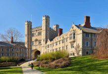 Gothic-style college building with archway and towers