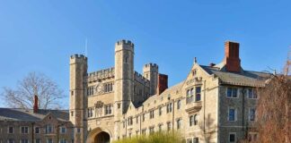Gothic-style college building with archway and towers