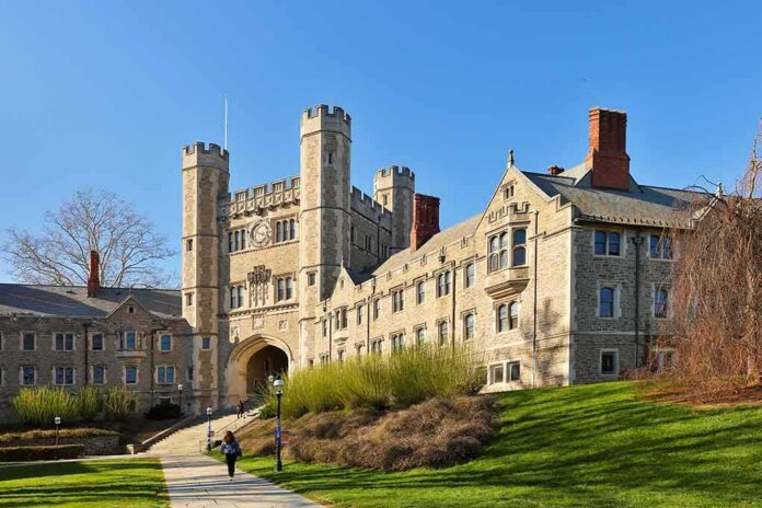 Gothic-style college building with archway and towers