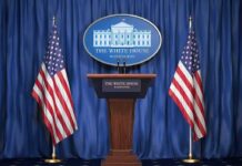 Trump Blasts Female Oval Officer Reporter For Asking Him This White House press podium with microphones and two American flags