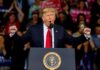 Dems Back Coup to OUST Trump Donald Trump speaking at a rally podium with arms raised