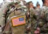 Pentagon Panic: 2,544 Mysterious Deaths Under Audit U.S. flag patch on a camouflage military uniform