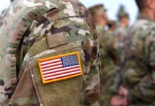Pentagon Panic: 2,544 Mysterious Deaths Under Audit U.S. flag patch on a camouflage military uniform