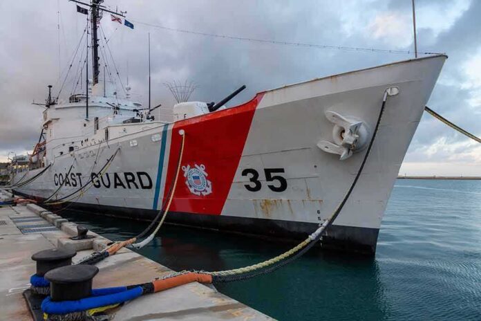 Coast Guard cutter moored at a pier
