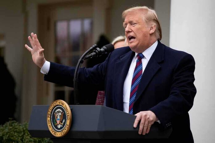 Donald Trump speaking at a podium outdoors