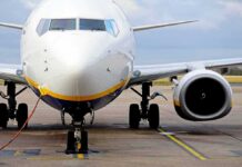 Passenger jet parked on tarmac front view