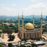 Mosque Tragedy: Killer Teens IDENTIFIED Golden-domed mosque with four minarets in a modern cityscape