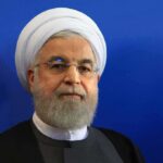 Fox & Friends TURN On Trump After THIS! Hassan Rouhani portrait against a blue background