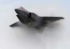 LEAKED F-35 Photo Sparks Secrecy Showdown Stealth fighter jet piercing a vapor cloud