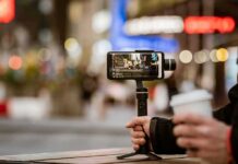 Influencer GUNNED DOWN During Livestream Smartphone on a handheld gimbal filming a city street at night
