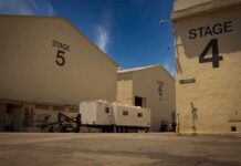 Hollywood Exodus – Paramount Leaves California Film studio stages with numbered buildings and trailer