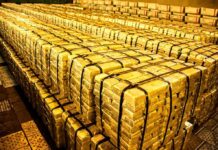 Workers DISCOVER $10 Million in Gold During Construction Stacks of gold bars strapped together in a vault