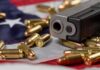 Handgun with bullets on an American flag