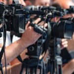 MSG Lockdown Sparks Swift Wedding Frenzy television cameras on tripods at a media event