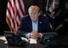 Bestiality Accusation Hijacks Trump – Disgusting! Person in suit seated at table with telephones