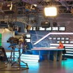Interviewer’s Expression During Trump Walkout Goes Hilariously VIRAL News studio with anchor at desk and cameras