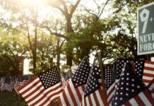 9/11 Memorial Defaced—Campus Erupts American flags displayed outdoors at a memorial