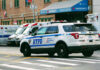 Killer Father’s Hospital Confession Stuns Cops Police car and ambulances outside emergency room entrance.