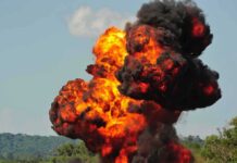 Cold War Relic Explodes Off Runway Fireball explosion with thick black smoke in open landscape