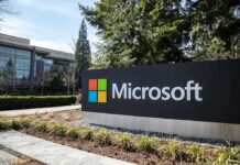 Microsoft Silently FIRES 60,000 Employees Microsoft sign outside a modern office campus