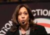 Kamala’s Husband BETRAYS Her, She’s Fuming woman speaking at a podium with microphone