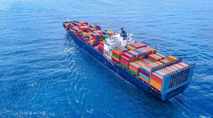 Container ship carrying colorful cargo containers at sea