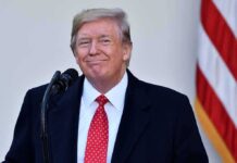 Trump’s Preemptive Pardons Loom – Prepares Exit Plan Donald Trump at a podium with a microphone