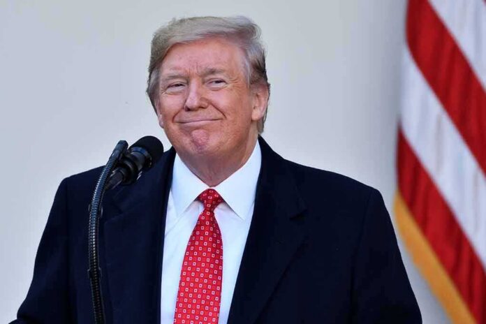 shutterstock_1572261577 Donald Trump at a podium with a microphone