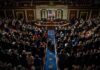 Legislative chamber audience stands and applauds