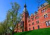 Cornell Offering Ivy League Degrees to Prisoners Historic red brick building with tower on a sunny day