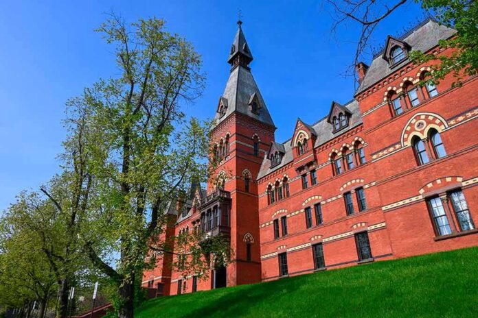 shutterstock_2301318055 Historic red brick building with tower on a sunny day