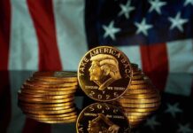 Gold Nude Trump Stuns Onlookers Gold commemorative coins stacked with a profile portrait in front of a U.S. flag