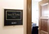 Office door sign in a hallway