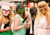 La Parka with three others in horror masks and costumes at an event