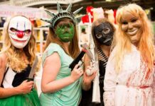 La Parka with three others in horror masks and costumes at an event